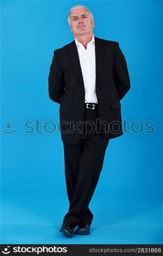 senior man in a suit standing