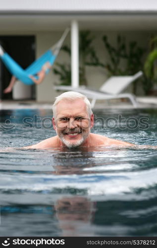 Senior man in a swimming pool