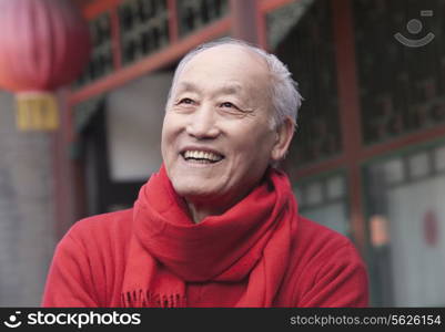 Senior Man in Traditional Chinese Courtyard