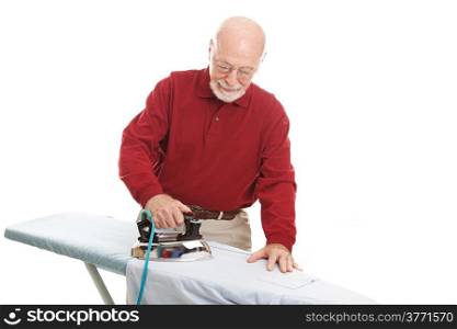 Senior man ironing a shirt. Isolated on white.