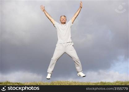 Senior Man Jumping In The Air