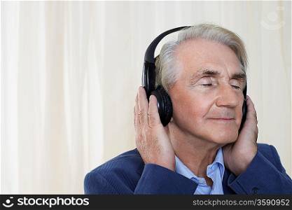 Senior Man Listening to Music