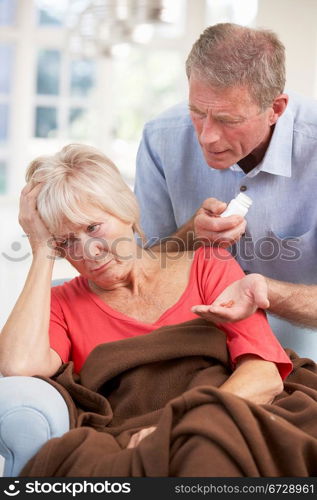 Senior man looking after sick wife