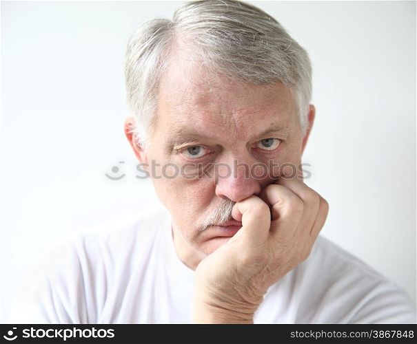 senior man looking very bored