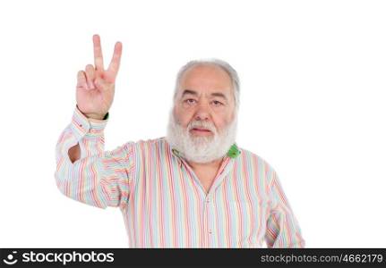 Senior man making the gesture of victory isolated on a white background