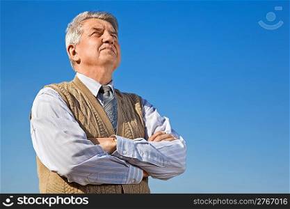 Senior man on background sky