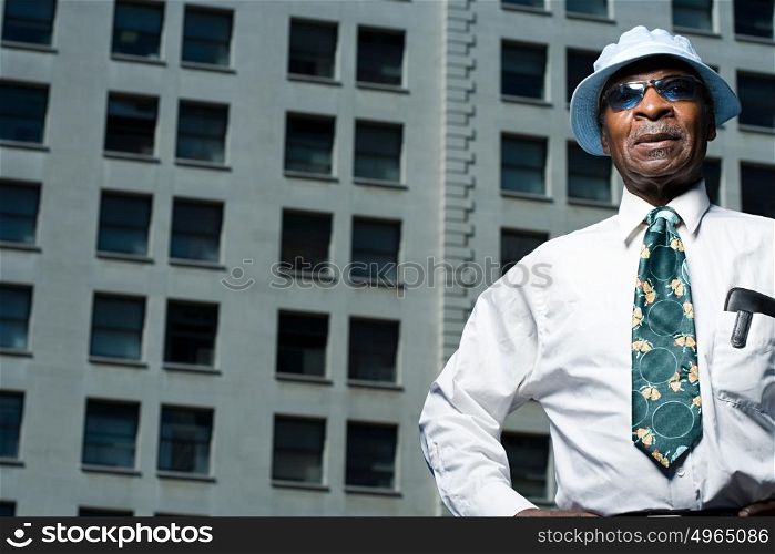 Senior man outside a building