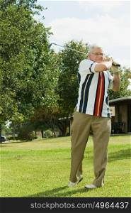 Senior man playing golf