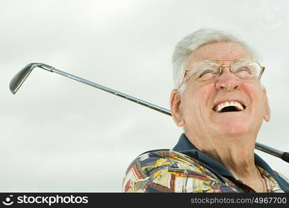 Senior man playing golf