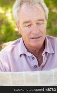 Senior man reading newspaper