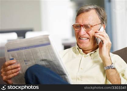 Senior man reading stock listings