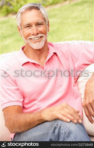 Senior Man Relaxing In Garden