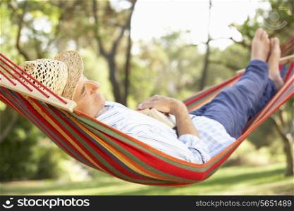 Senior Man Relaxing In Hammock