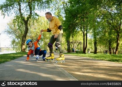 Senior man roller skating with little boy in urban park. Cheerful grandfather catching grandson falling upside down. Happy parenting and childhood. Senior man roller skating with little boy in urban park