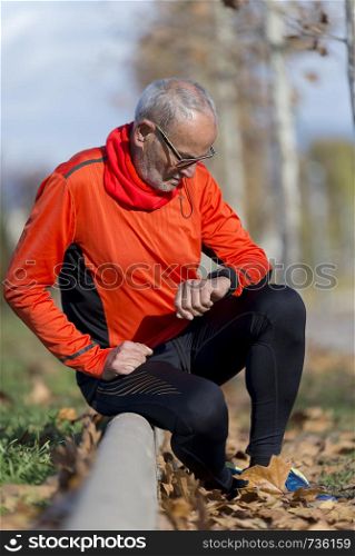Senior man setting up the smart watch