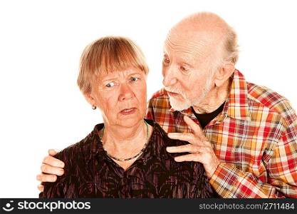 Senior man sharing information with concerned wife