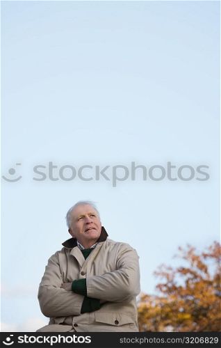Senior man sitting and thinking