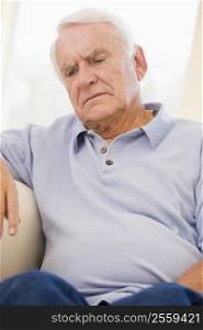 Senior Man Sitting On Couch