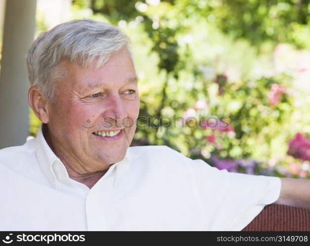 Senior man sitting outdoors