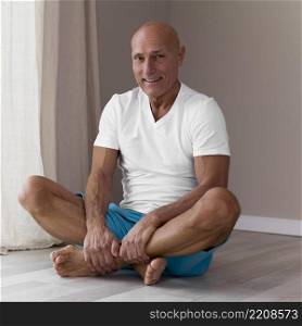 senior man sitting yoga lotus position