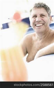 Senior man smiling in a swimming pool