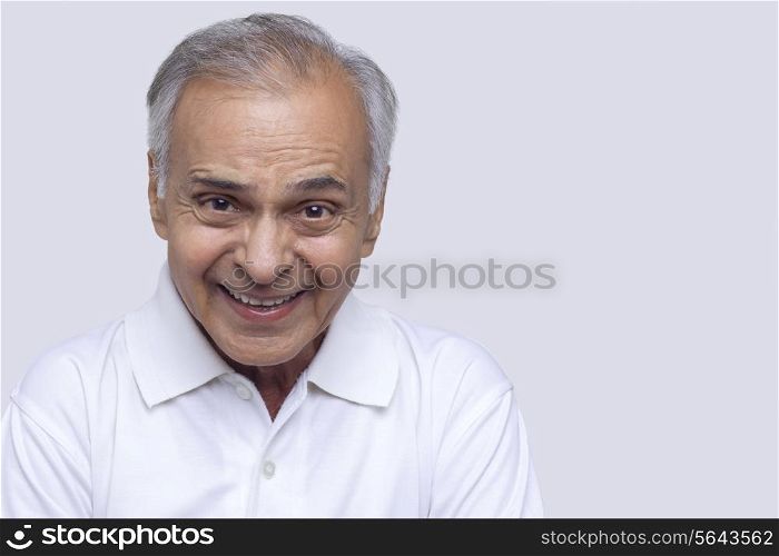 Senior man smiling over white background