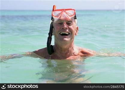 Senior man snorkeling