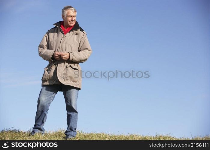 Senior Man Standing In Park