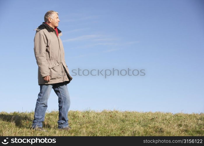 Senior Man Standing In Park