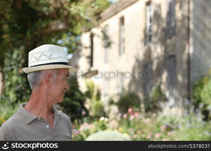 Senior man standing outdoors
