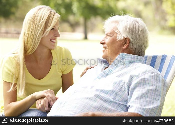 Senior Man Talking To Adult Daughter