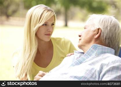 Senior Man Talking To Concerned Adult Daughter