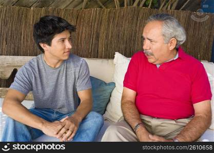 Senior man talking to his grandson