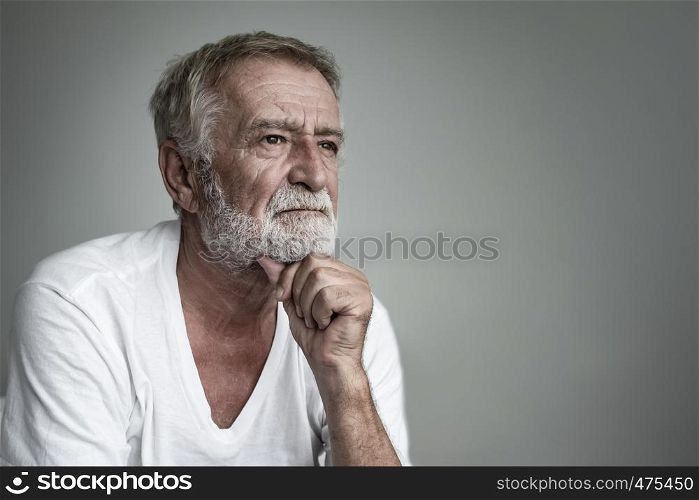 senior man thinking or try to remember alone closeup