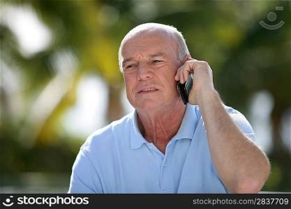 Senior man using a cellphone