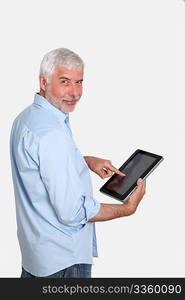 Senior man using electronic tablet