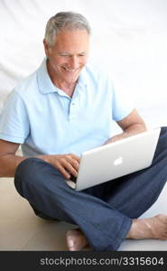 Senior man using laptop computer