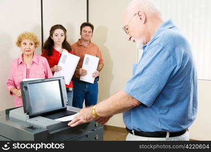 Senior man voting on Florida&rsquo;s optical scanning machine.