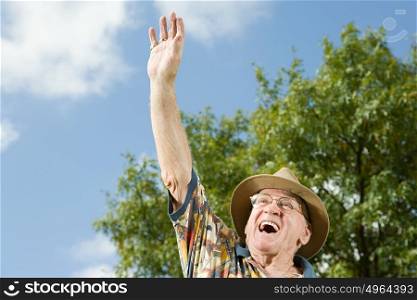 Senior man waving