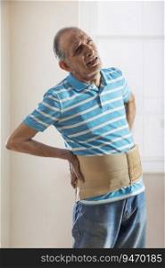 Senior man wearing a belt around his waist.  Health and fitness 