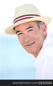 Senior man wearing a summer hat