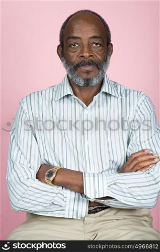 Senior man with crossed arms