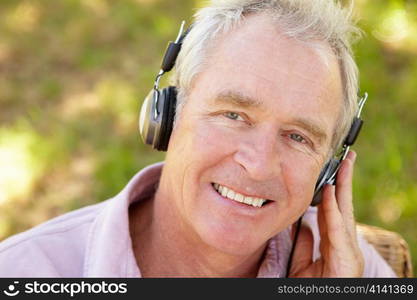 Senior man with headphone