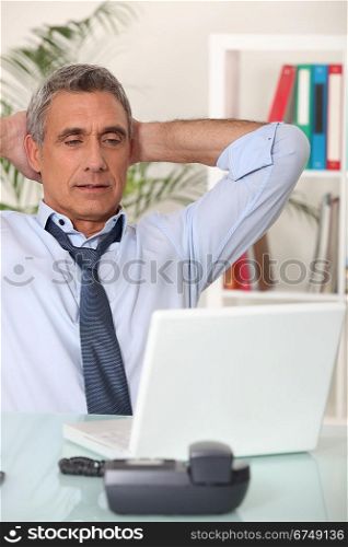 Senior man with his laptop