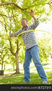 Senior man with hula-hoop