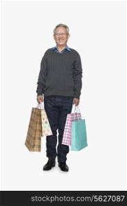 Senior man with shopping bags