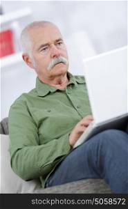senior man working on laptop computer