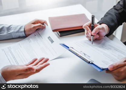 Senior manager HR reading a resume during a job interview employee young man meeting Applicant and recruitment