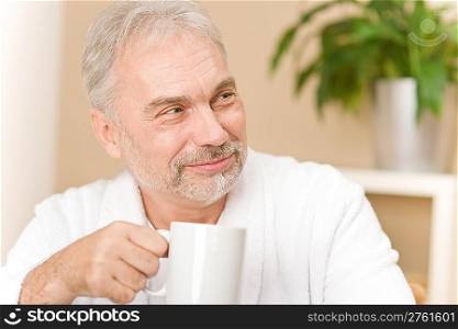 Senior mature man - breakfast at home with coffee