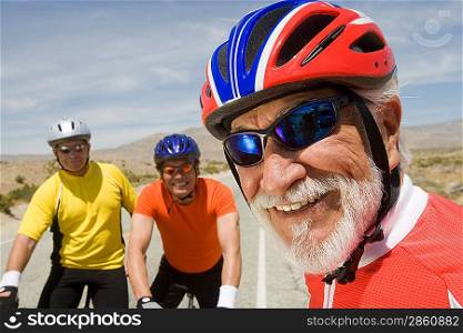Senior men wearing cycling helmets